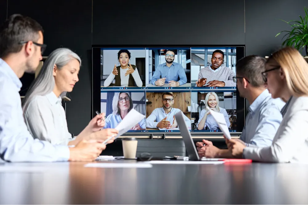 company collaborating with international remote team in global video meeting