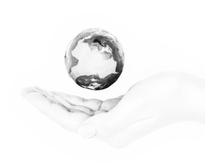 image of woman holding hand under earth