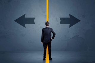 Business person choosing between two options